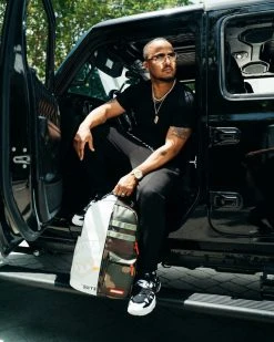 SPRAYGROUND® BAGS SPLIT WEIRD BACKPACK (DLXV)