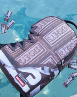 SPRAYGROUND® BAGS HERSHEY’S SHARK BITE BACKPACK 18 SPRAYGROUND® BAGS HERSHEY’S SHARK BITE BACKPACK