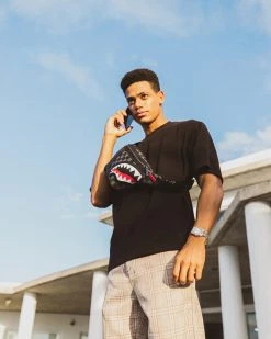 SPRAYGROUND® CROSSBODYS HENNY AIIR TO THE THRONE SAVVY CROSSBODY