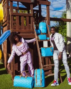 SPRAYGROUND® ILLUCHAINS TURQ CROSSOVER CLUTCH CROSSOVER CLUTCHES