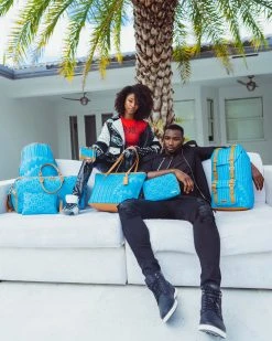 SPRAYGROUND® ILLUCHAINS TURQ CROSSOVER CLUTCH CROSSOVER CLUTCHES