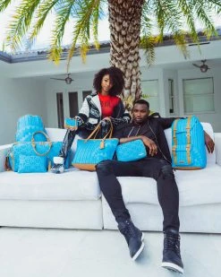 SPRAYGROUND® ILLUCHAINS TURQ TOILETRY BAG BAGS